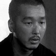 Portrait of the solemn face of a Japanese man, the actor Chiaki Minoru
