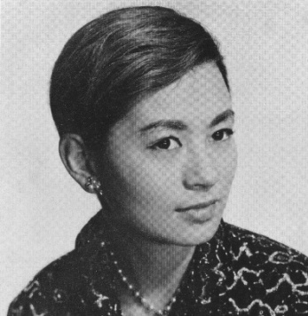 Publicity photo of a stylish young Japanese woman of the 1950s, looking askance at the camera