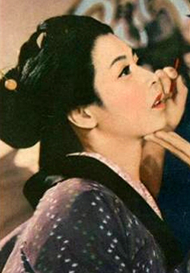 Medium shot of a young Japanese woman in traditional dress, looking upwards