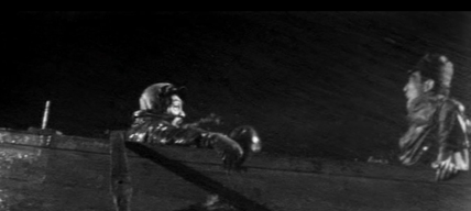 Two of the men that were on the train in the images above, Inukai and Nijima, still wearing their Army uniforms, are engaged in a fight to the death in a rowboat during a storm.