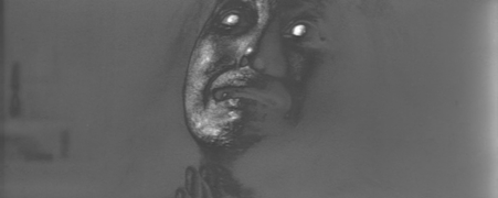 Closeup of a woman with no eyes in a kind of trance state, the image appearing as if an undeveloped negative