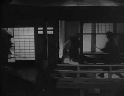 A very dark room at night is shown, in which men are fighting with swords, their faces obscured