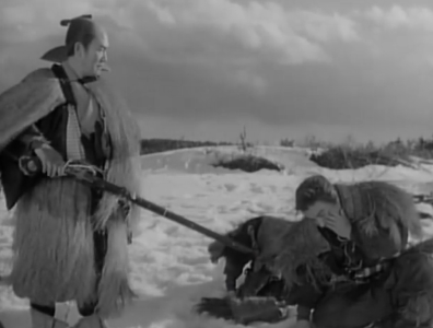 In 19th Century Japan, a standing man in the snow, wearing traveling clothes, points a rifle at an animal on the ground,  next to which a man and a young boy bow to him